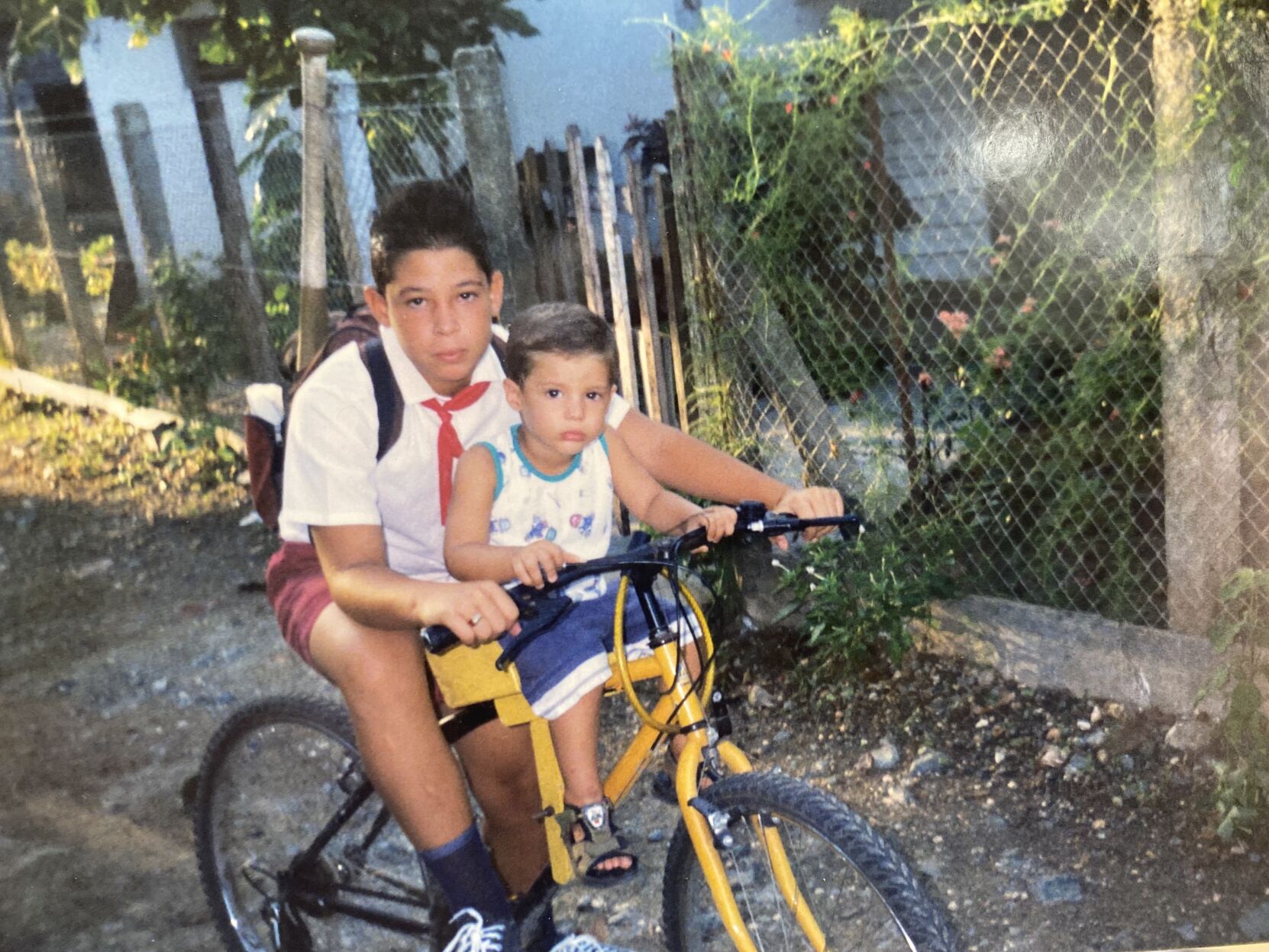 Vitin and Victor Mederos on a bike